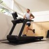 Man running on Inspire T7s Treadmill